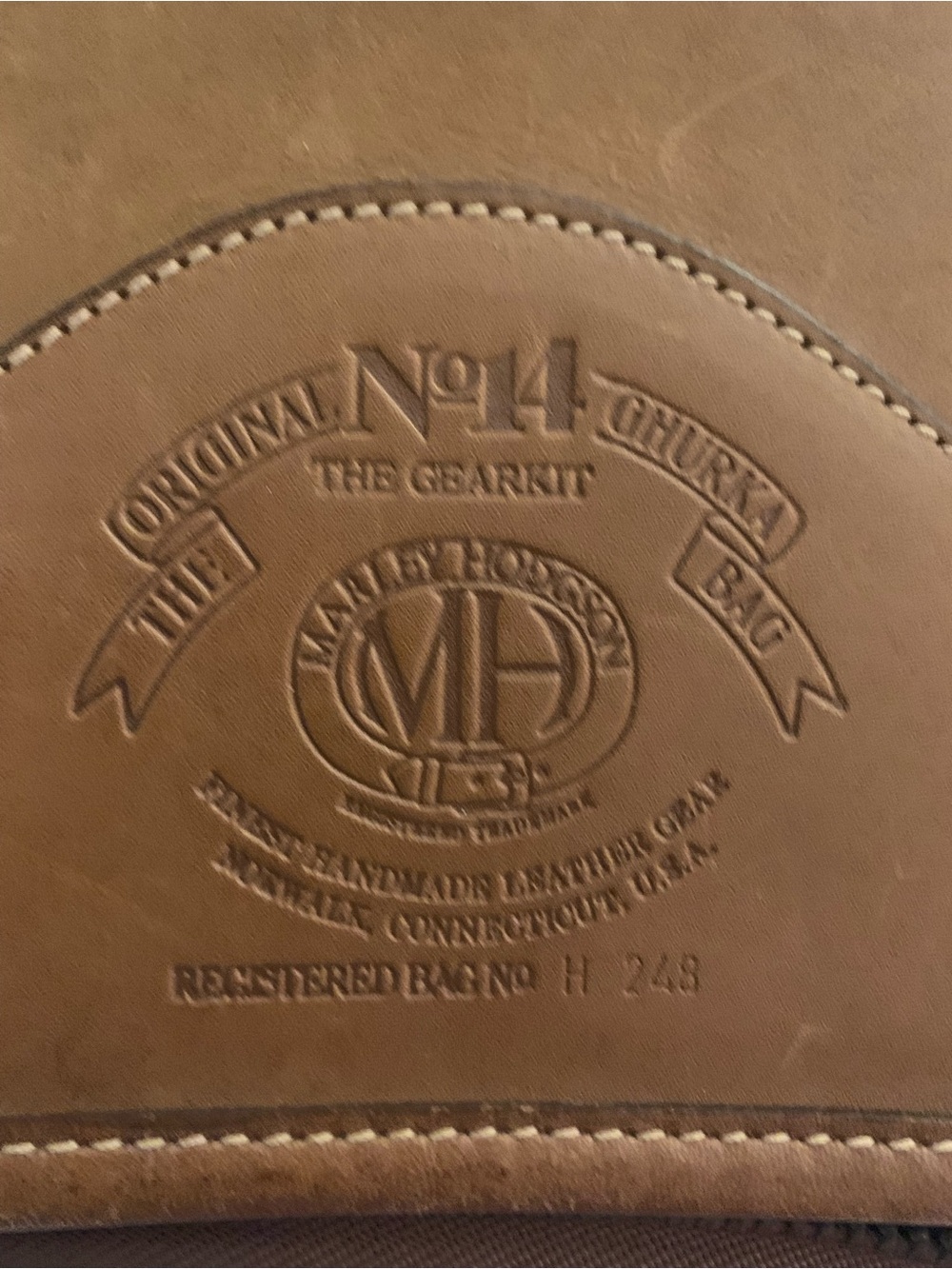The Sak Brown Leather Garment Bag Panel with Embossed Logo